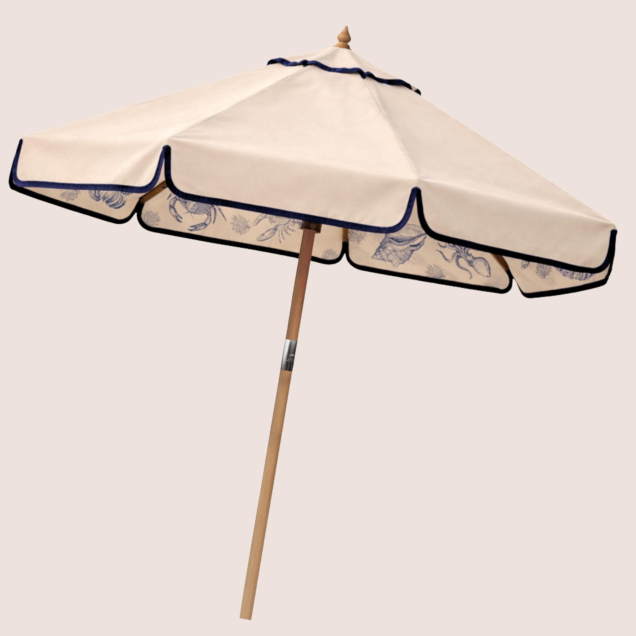Harbour Ink Harbour Bounty coastal-inspired garden parasol featuring coral and shell illustrations.