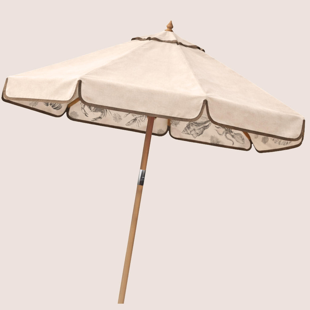 Oyster Shell Harbour Bounty coastal-inspired garden parasol featuring coral and shell illustrations.