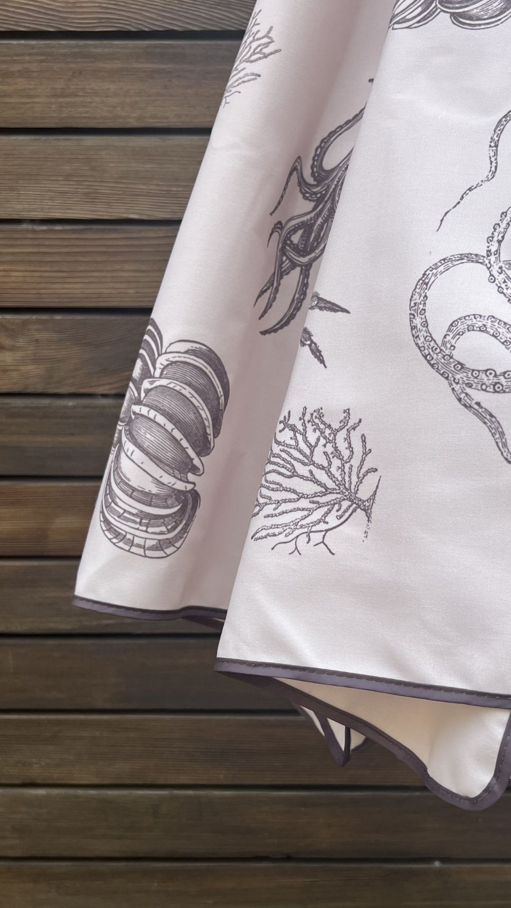 close up video detail of marine illustrations on the Harbour Bounty Oyster Shell colourway 2.4m hardwood parasol