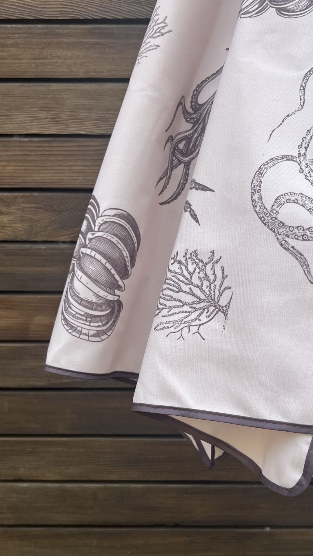 close up video detail of marine illustrations on the Harbour Bounty Oyster Shell colourway 2.4m hardwood parasol